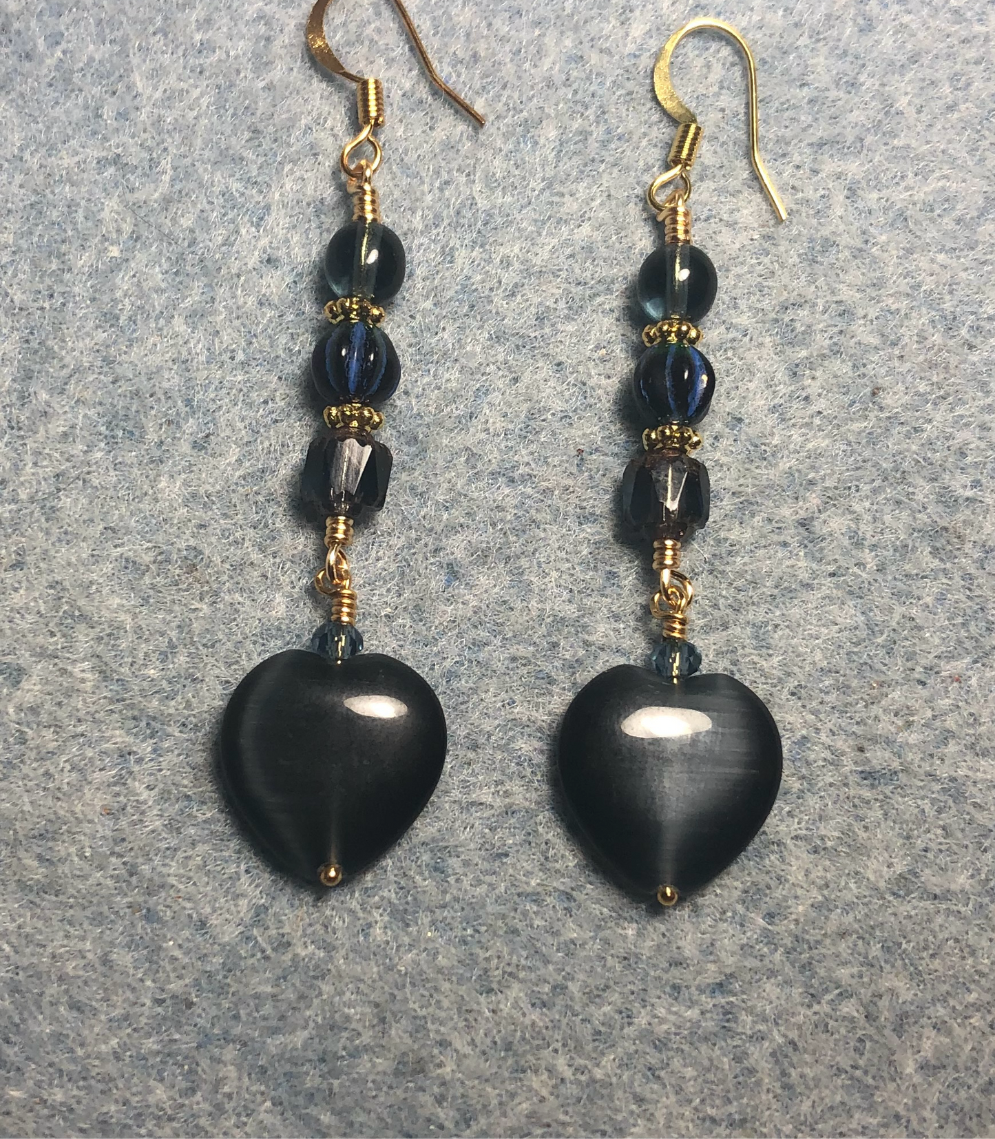Montana blue fiber optic (cat’s eye) Czech glass heart bead earrings adorned with Montana blue Czech glass beads.