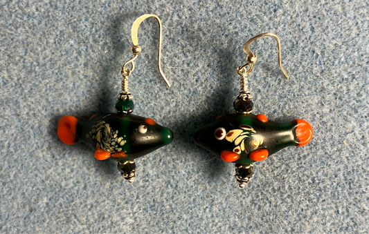 Emerald green lamp work fish bead earrings adorned with emerald green Chinese crystal beads.