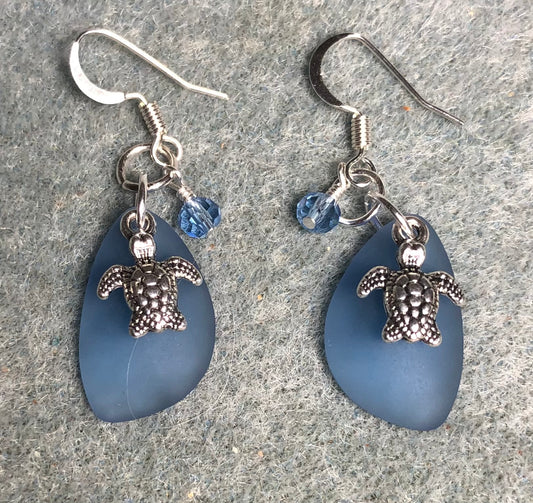 Small light blue sea glass pendant bead earrings adorned with small silver sea turtle charms and small light blue Chinese crystal beads.