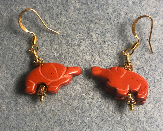 Small red poppy jasper gemstone elephant bead earrings adorned with orange Chinese crystal beads.