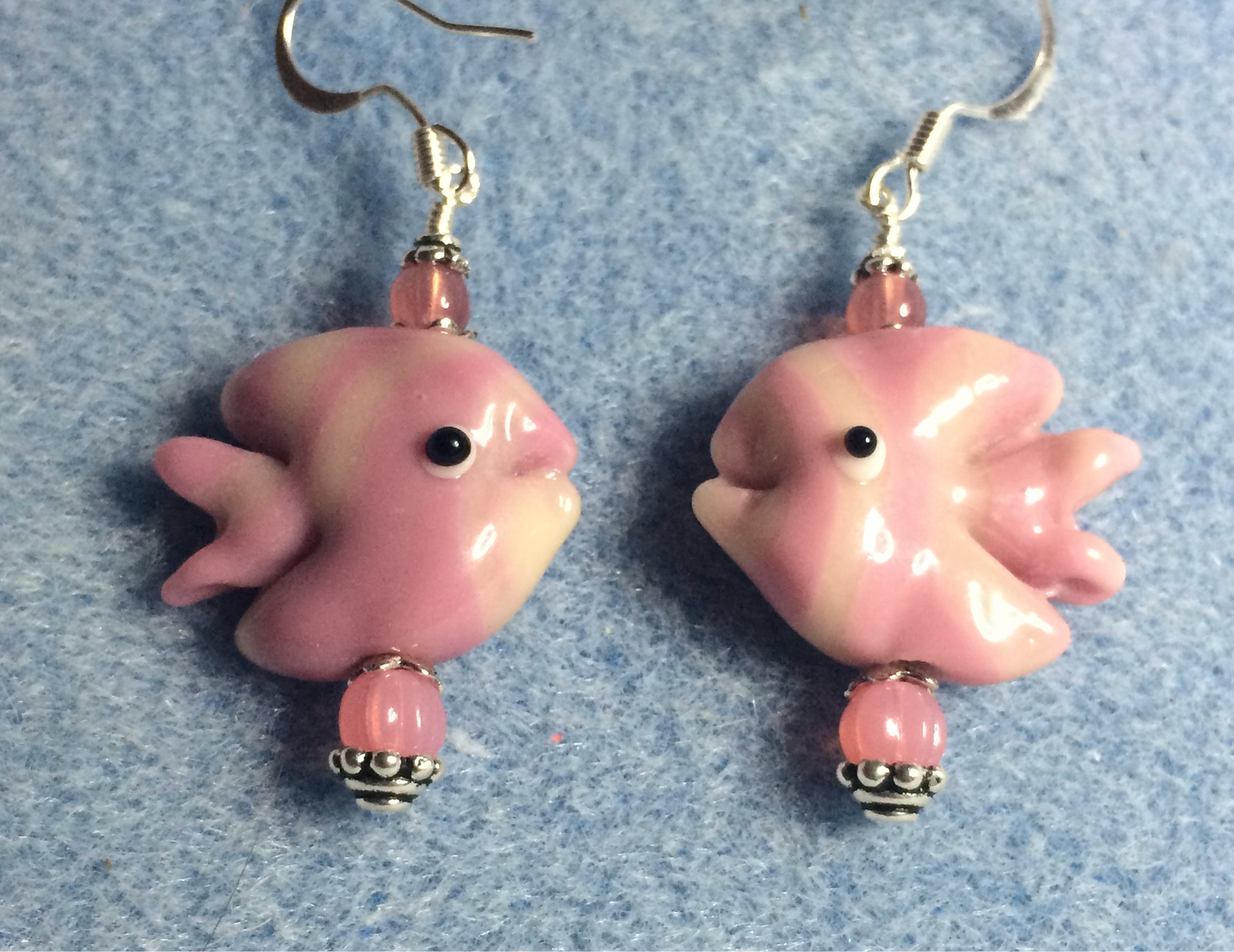 Dark pink and light pink lamp work striped angelfish bead earrings adorned with pink Czech glass beads.