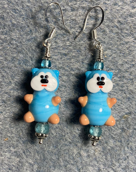 Large light turquoise and white lamp work teddy bear bead earrings adorned with light turquoise Czech glass beads.