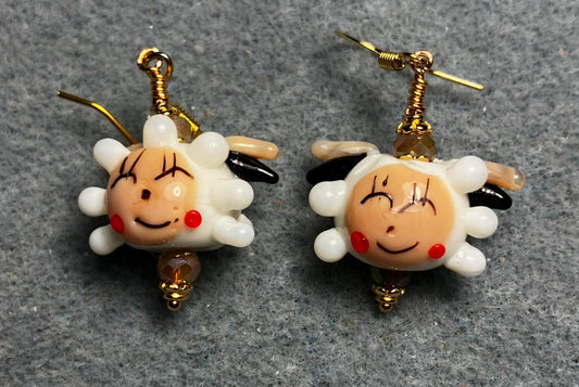 White, beige, and red lamp work sheep bead earrings adorned with beige Chinese crystal beads.