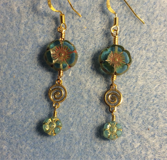 Turquoise Czech glass pansy bead earrings adorned with gold swirly connectors and tiny turquoise Czech glass daisy beads.