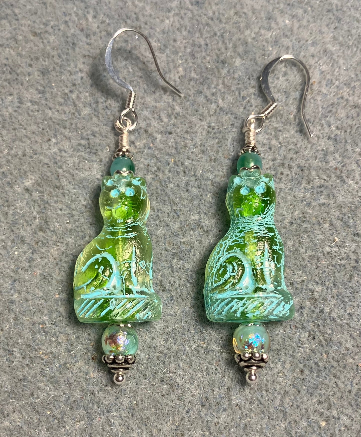 Translucent light green (with turquoise inlay) fancy Czech glass fancy cat bead earrings adorned with aqua green Czech glass beads.
