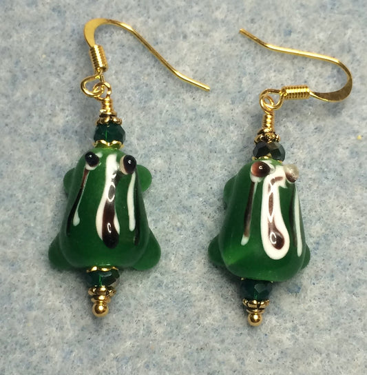 Green with black stripes lamp work frog bead earrings adorned with green Chinese crystal beads.