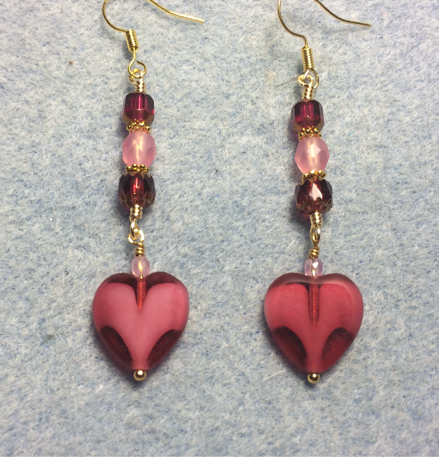 Bright pink Czech glass heart bead earrings adorned with pink Czech glass beads.
