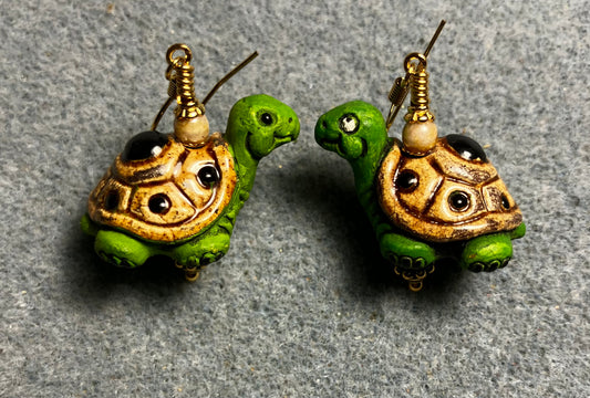Green and tan ceramic turtle bead earrings adorned with tan Czech glass beads.
