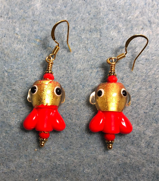 Red and gold lamp work fish bead earrings adorned with red Chinese crystal beads.