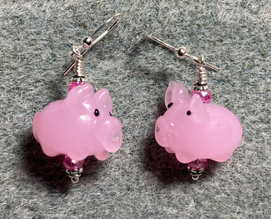 Light pink lamp work pig bead earrings adorned with hot pink Chinese crystal beads.