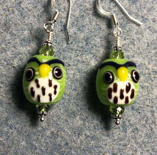 Lime green and white lamp work spotted owl bead earrings adorned with lime green Chinese crystal beads.