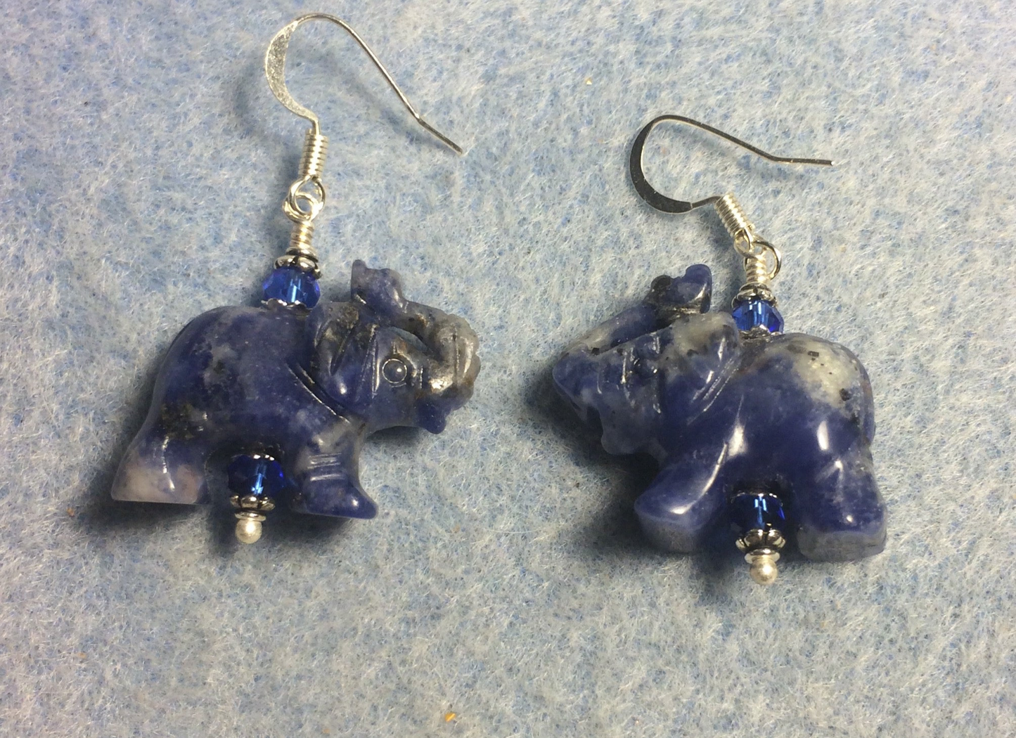 Blue sodalite gemstone elephant bead earrings adorned with blue Chinese crystal beads.