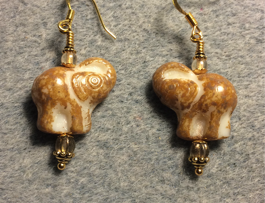 Tan (with cream inlay) Czech glass elephant bead earrings adorned with tan Czech glass beads.