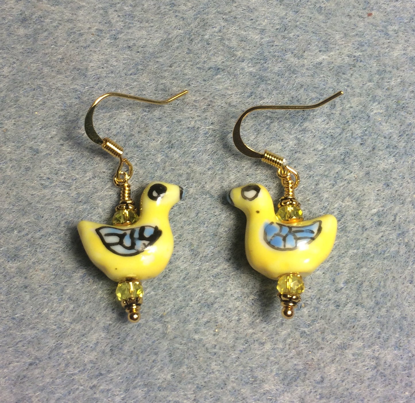 Small yellow and blue ceramic geese bead earrings adorned with yellow Chinese crystal beads.