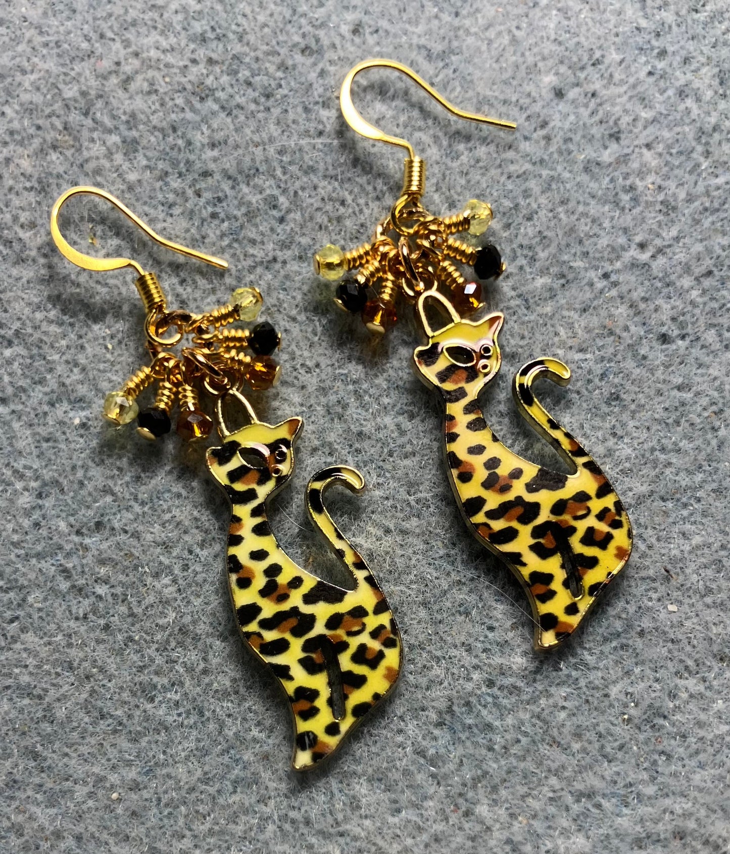 Yellow, black, and topaz enamel spotted cat charm earrings adorned with tiny dangling yellow, black, and topaz Chinese crystal beads.
