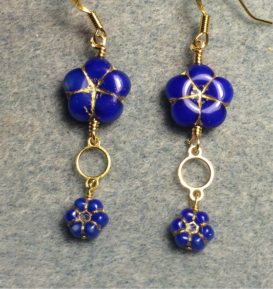 Bright blue Czech glass puffy flower bead earrings adorned with gold circle connectors and small bright blue Czech glass poppy beads.