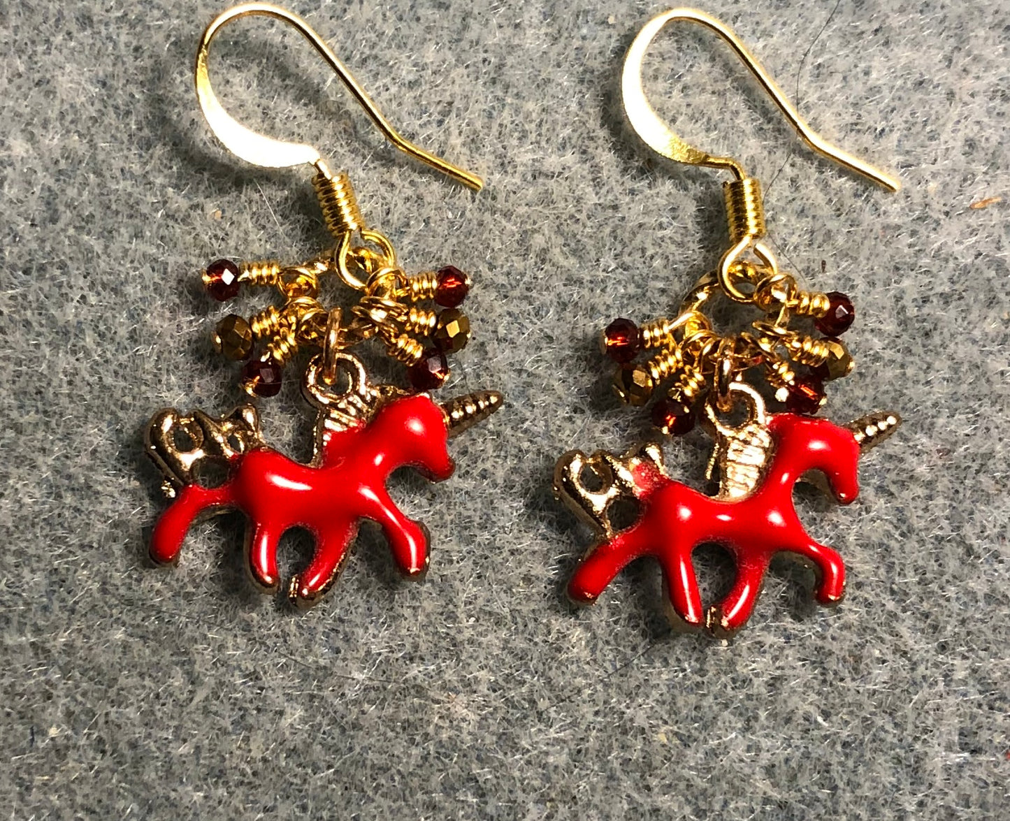 Tiny red and gold enamel unicorn charm earrings adorned with tiny dangling red and gold Chinese crystal beads.