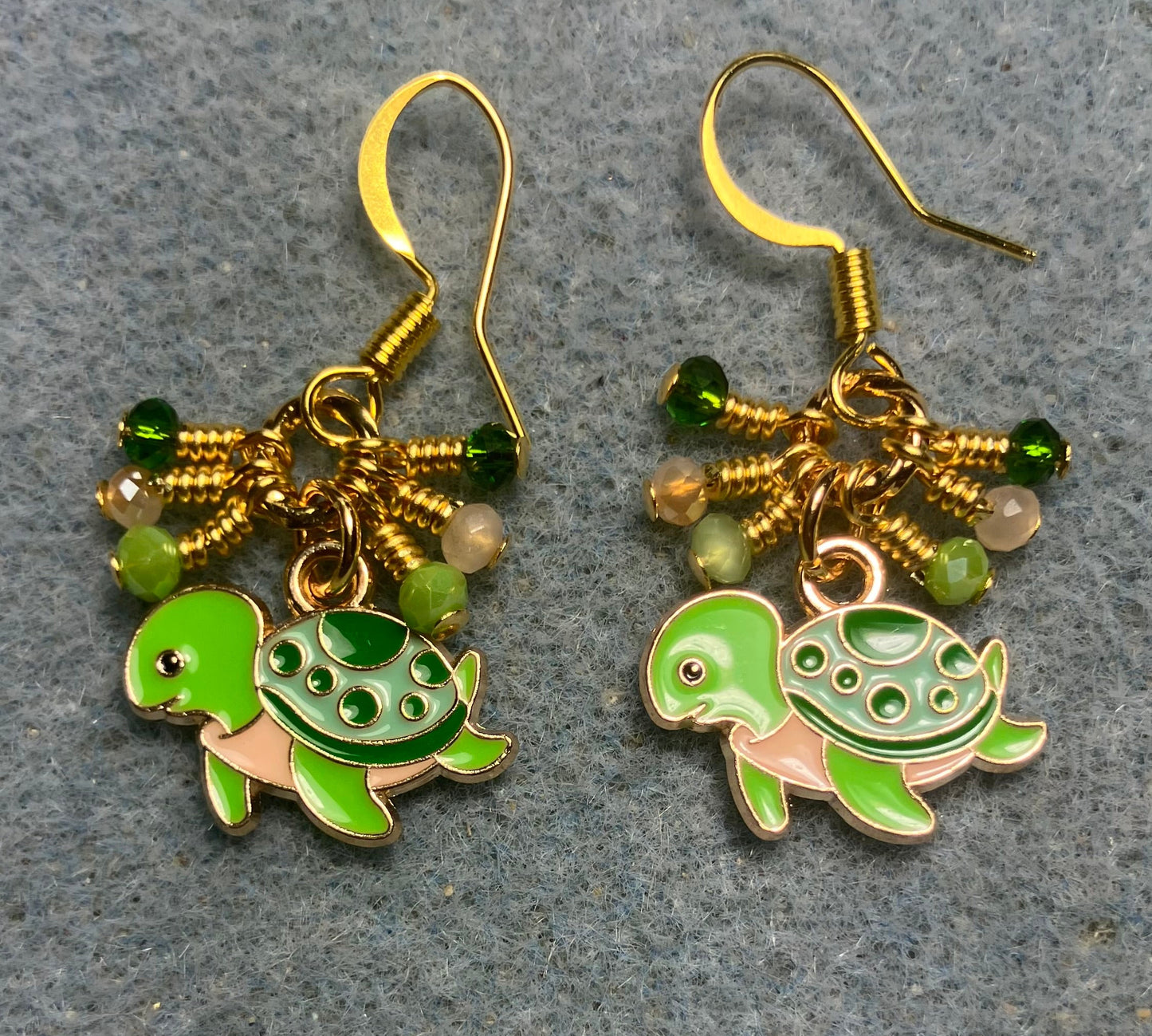 Lime green, peach, and dark green enamel turtle charm earrings adorned with tiny dangling lime green, peach, and dark green Chinese crystal beads.