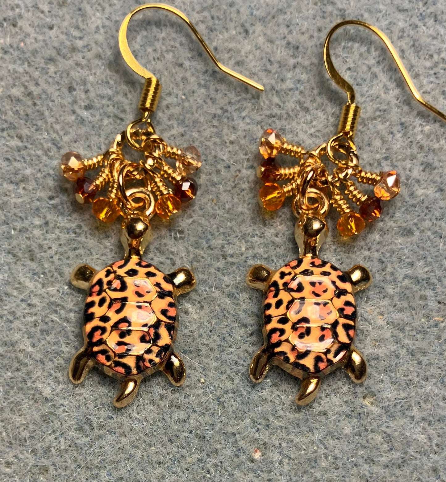 Orange, brown, and amber enamel turtle charm earrings adorned with tiny dangling orange, brown, and amber Chinese crystal beads.