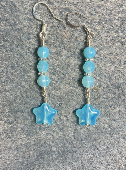 Small light turquoise Czech glass star bead earrings adorned with light turquoise Czech glass beads.