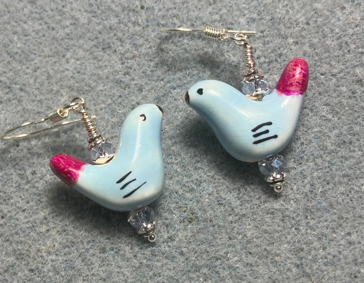 Small light blue and hot pink ceramic bird bead earrings adorned with light blue Chinese crystal beads.