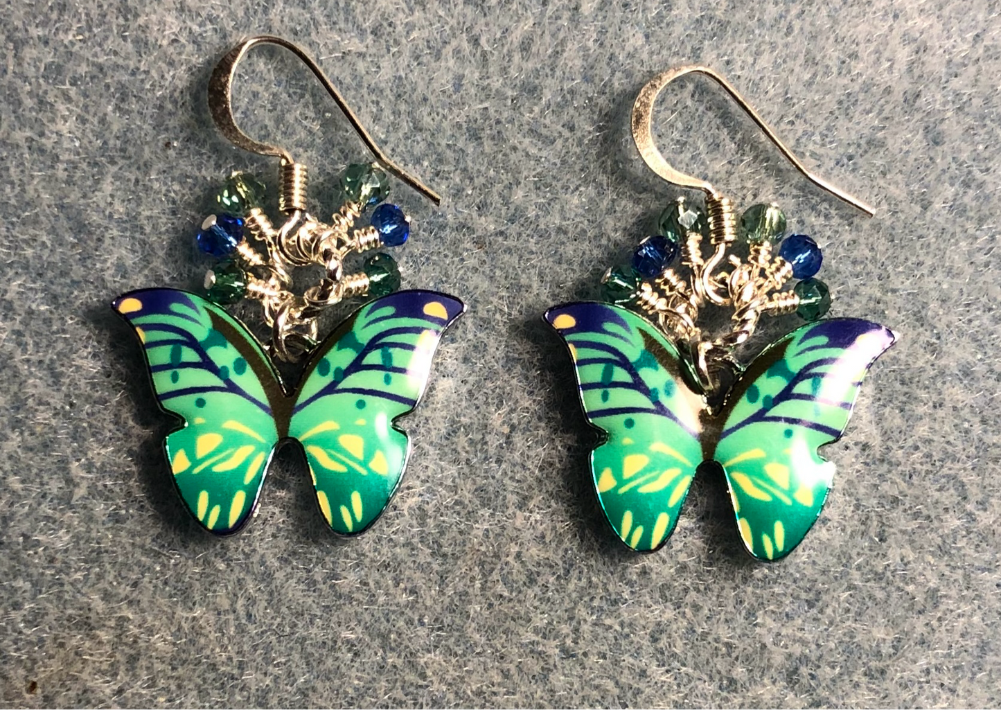 Green, aqua, and blue enamel butterfly charm earrings adorned with tiny dangling green, aqua, and blue Chinese crystal beads.