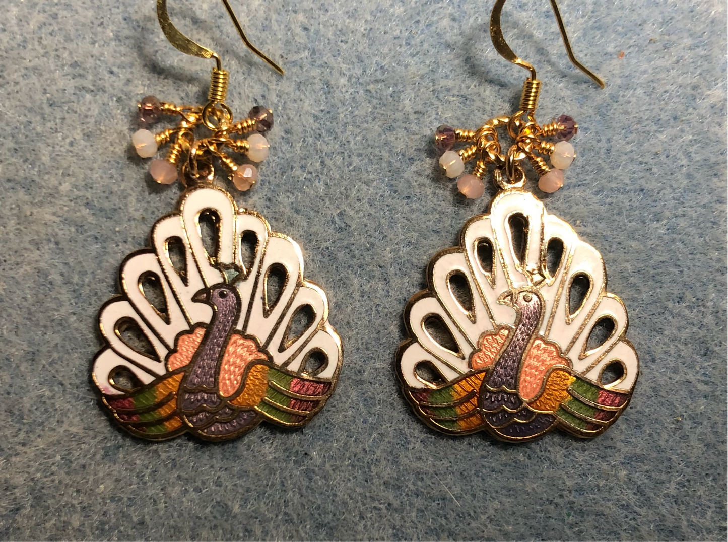 White, peach, and violet cloisonné peacock charm earrings adorned with tiny white, peach, and violet Chinese crystal beads.