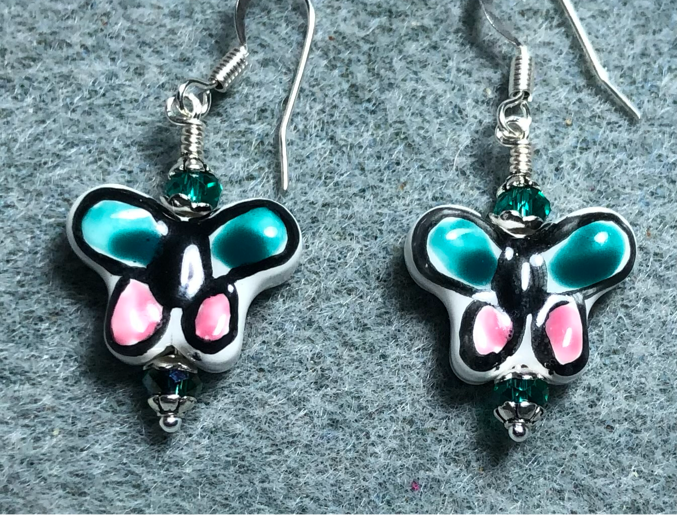 Teal and pink ceramic butterfly bead earrings adorned with teal Chinese crystal beads.