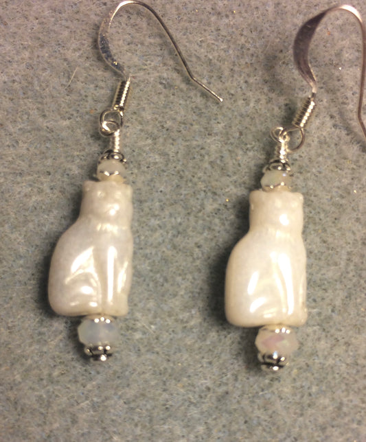 Small shimmery white Czech glass cat bead earrings adorned with white Chinese crystal beads.