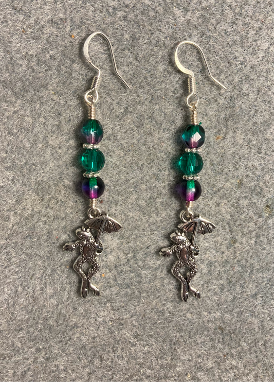 Silver frog holding an umbrella charm earrings adorned with teal purple and teal Czech glass beads