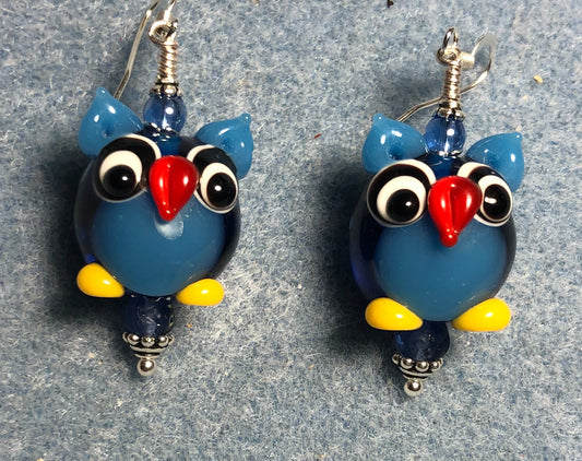 Blue lamp work owl bead earrings adorned with blue Czech glass beads.