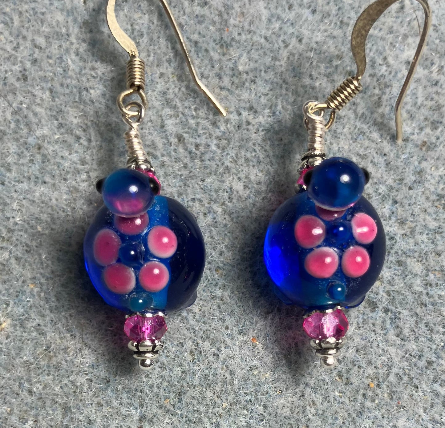 Bright blue and hot pink lamp work turtle bead earrings adorned with hot pink Chinese crystal beads.