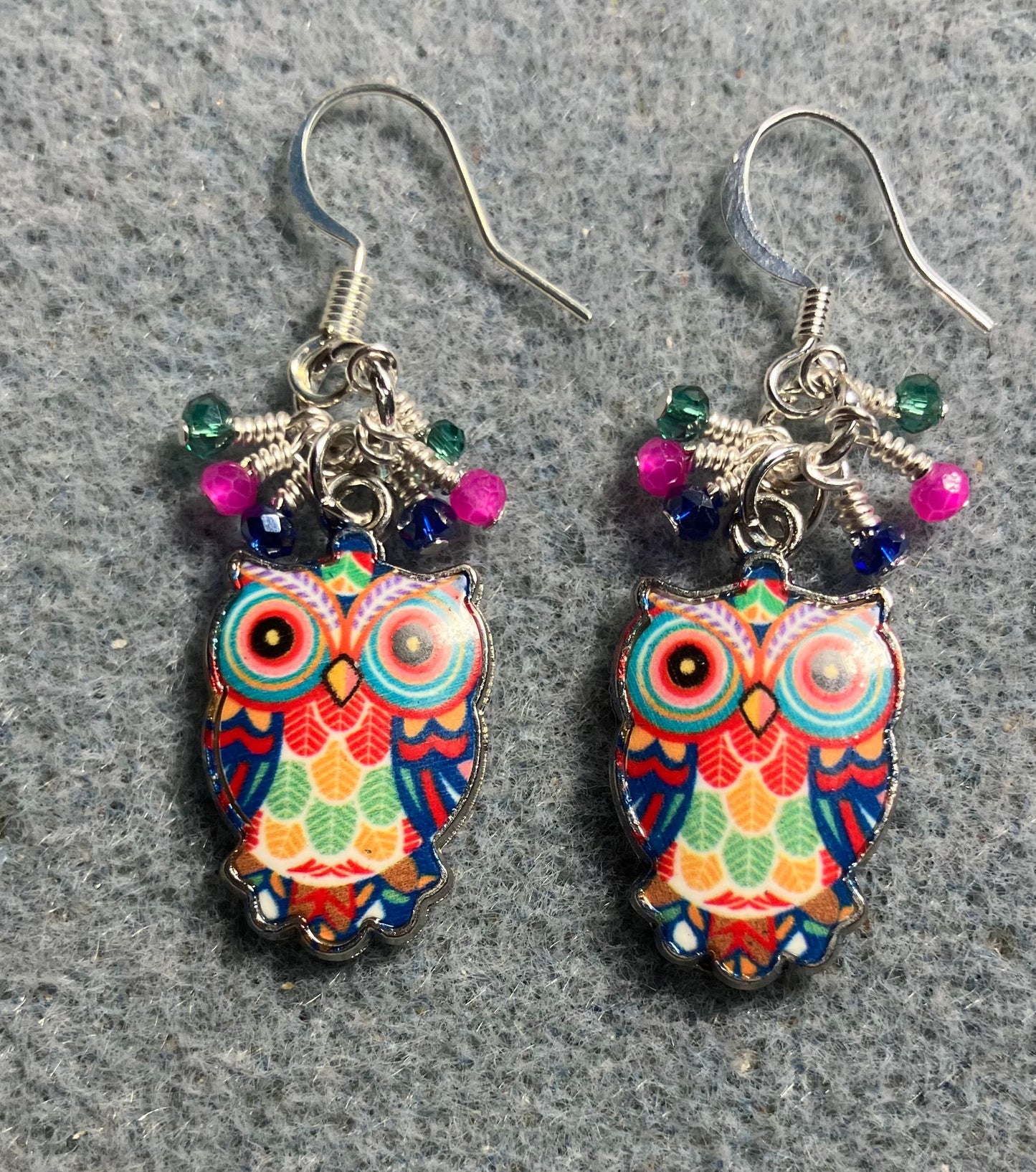 Pink, dark blue, and teal enamel owl charm earrings adorned with tiny dangling pink, dark blue, and teal Chinese crystal beads.