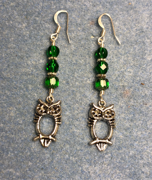 Small silver owl charm earrings adorned with emerald green Czech glass beads