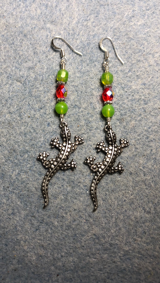 Long silver lizard charm earrings adorned with lime green and red Czech glass beads