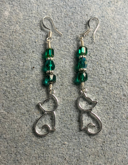 Silver silhouette cat charm earrings adorned with teal Czech glass beads.