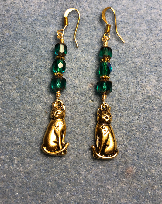 Gold cat charm earrings adorned with teal Czech glass beads
