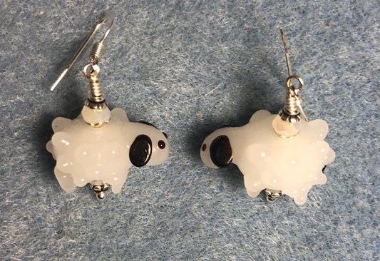 White and black lamp work sheep bead earrings adorned with white Chinese crystal beads.