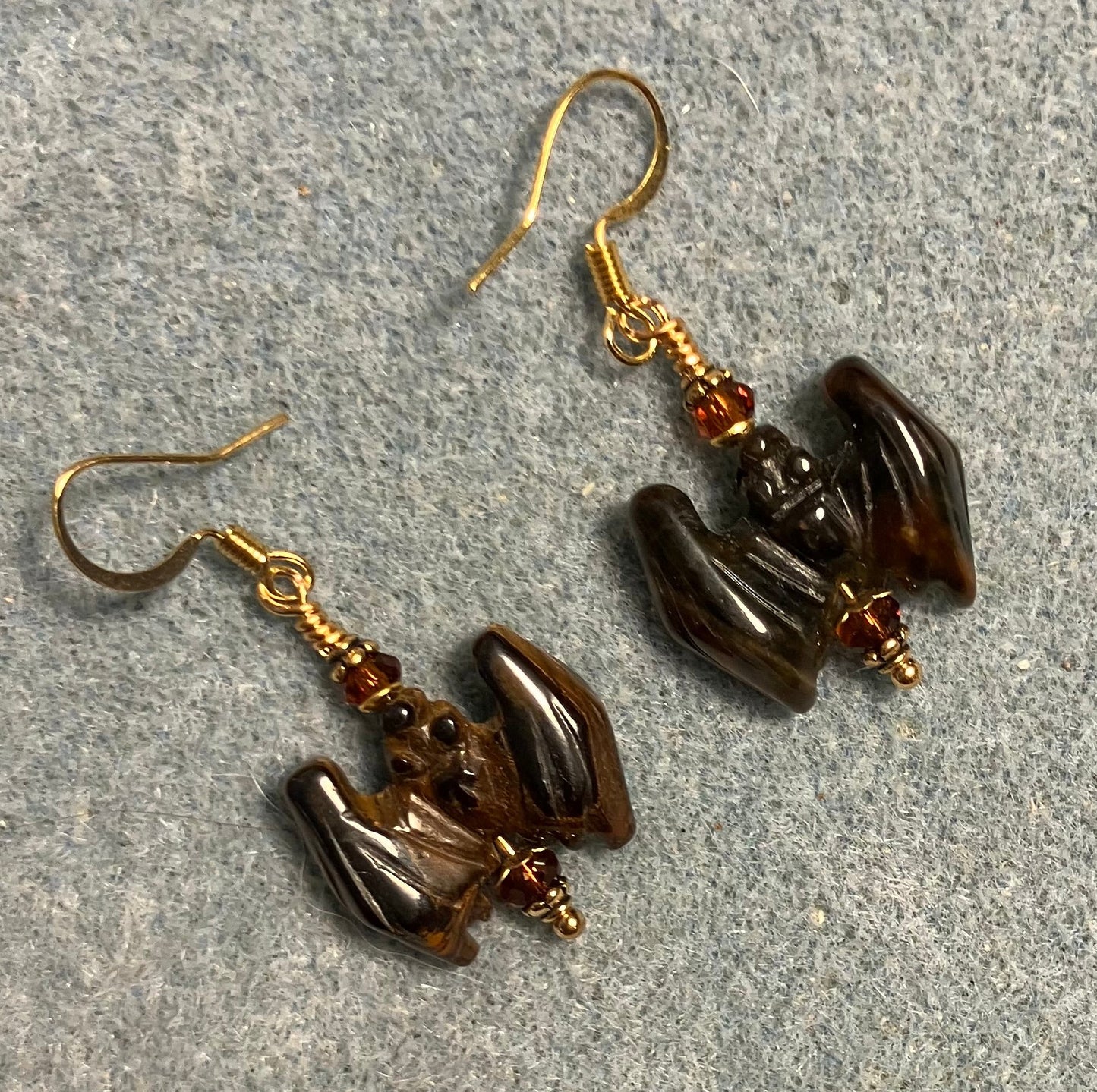 Brown tigereye gemstone bat bead earrings adorned with brown Chinese crystal beads.