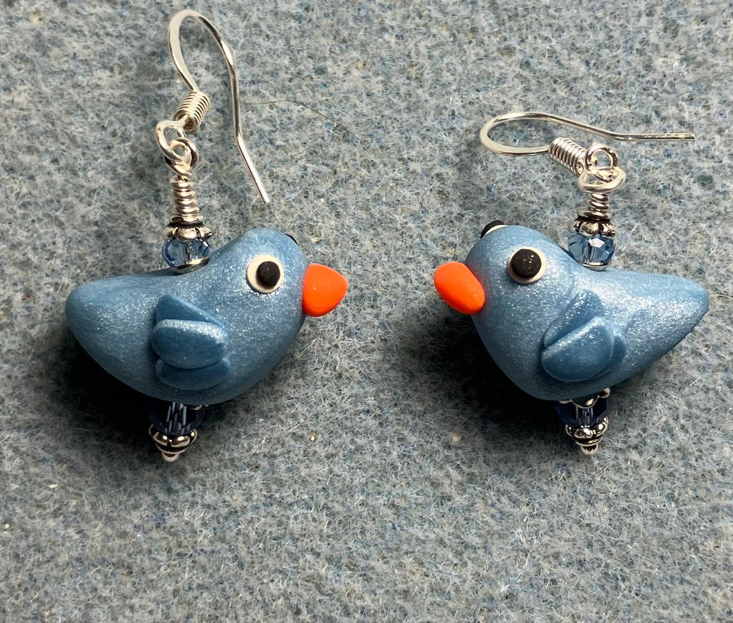 Small light blue polymer clay bird bead earrings adorned with light blue Chinese crystal beads.