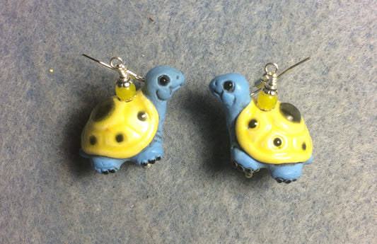 Large light blue and yellow ceramic turtle bead earrings adorned with yellow Czech glass beads.