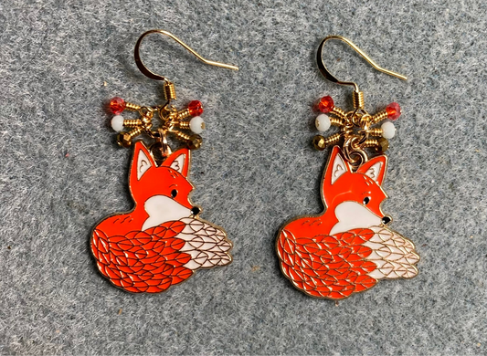 Orange and off white enamel origami fluffy tailed fox charm earrings adorned with tiny dangling orange, off white, and gold Chinese crystal beads.