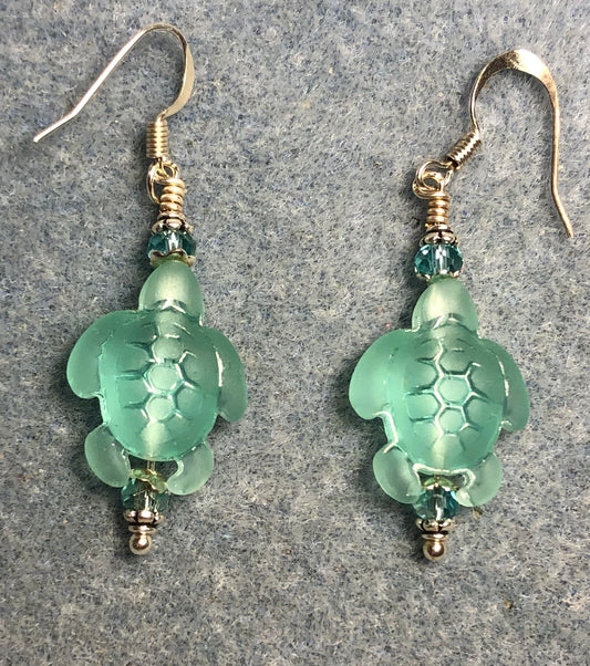 Light green sea glass sea turtle bead earrings adorned with light green Chinese crystal beads.