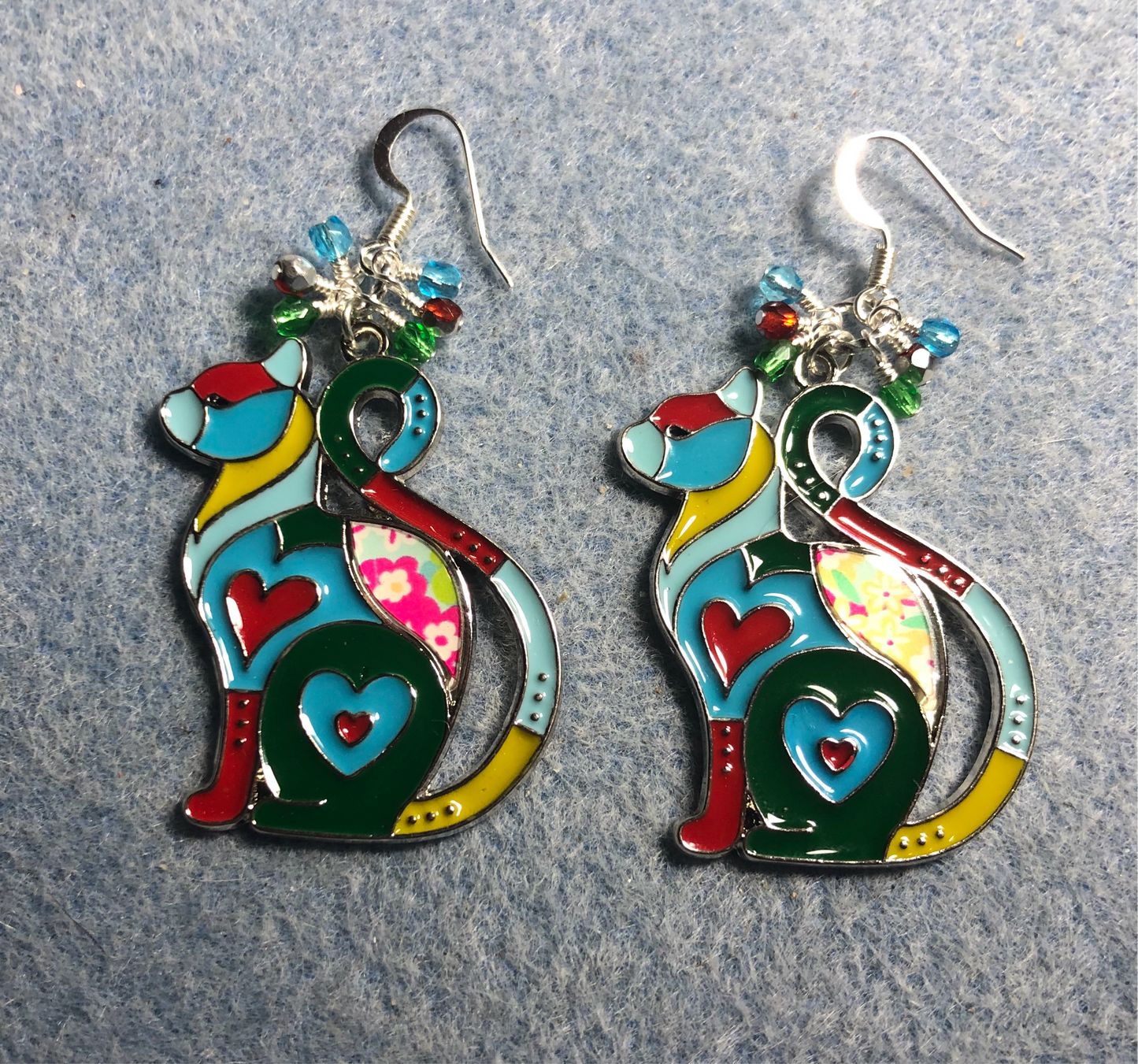 Colorful enamel cat charm earrings adorned with small dangling turquoise, red, and green Chinese crystal beads.