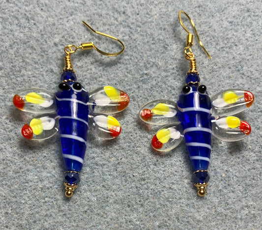Dark blue, red, and yellow lamp work dragonfly bead earrings adorned with dark blue Chinese crystal beads.