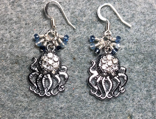 Silver and clear rhinestone octopus charm earrings adorned with tiny dangling light blue, silver, and dark blue Chinese crystal beads.