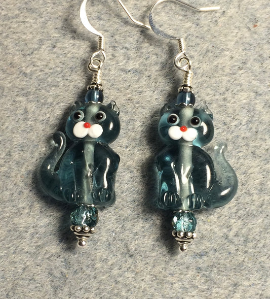 Translucent Montana blue lamp work cat bead earrings adorned with Montana blue Czech glass beads.
