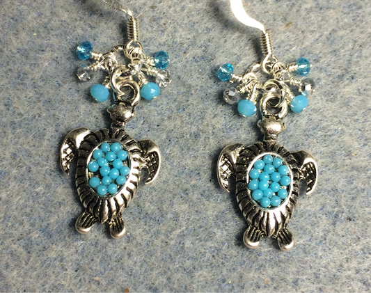 Silver and turquoise enamel turtle charm earrings adorned with tiny dangling silver and turquoise Chinese crystal beads.