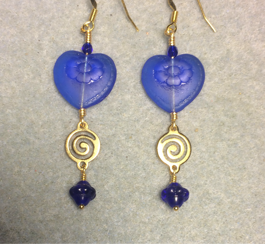 Dark blue Czech glass heart bead earrings adorned with gold swirly links and dark blue Czech glass Saturn beads.