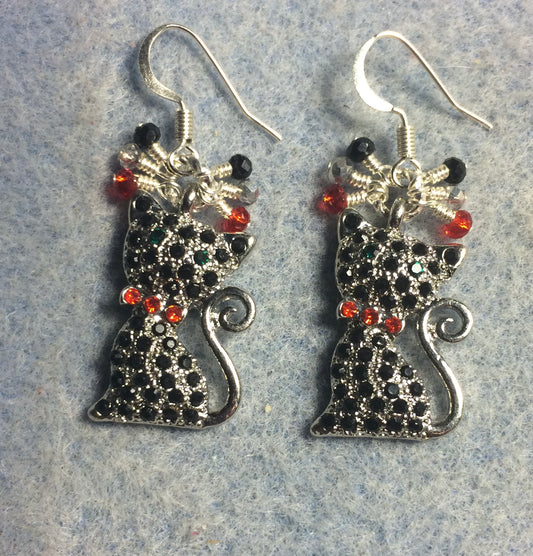 Black and red rhinestone cat charm earrings adorned with small dangling silver, black, and red Chinese crystal beads.